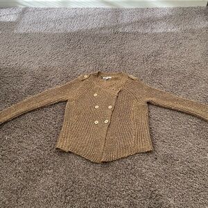 Jennif Lopez gold sweater in the size med . Great for the Holidays!